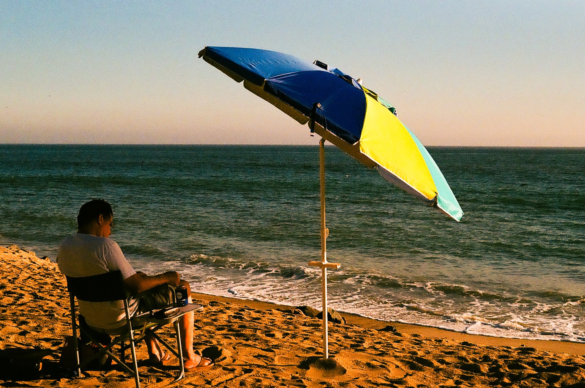 man sitting on a beach chair